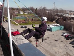 Training - rappelling off roof of building